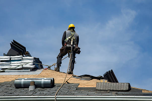 Professional Storm Damage Roof Repair technician working in Washington, IA